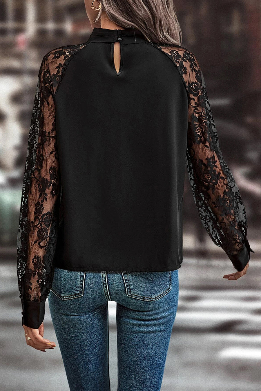 Black lace sleeve blouse with keyhole neckline and button closure at back neck.