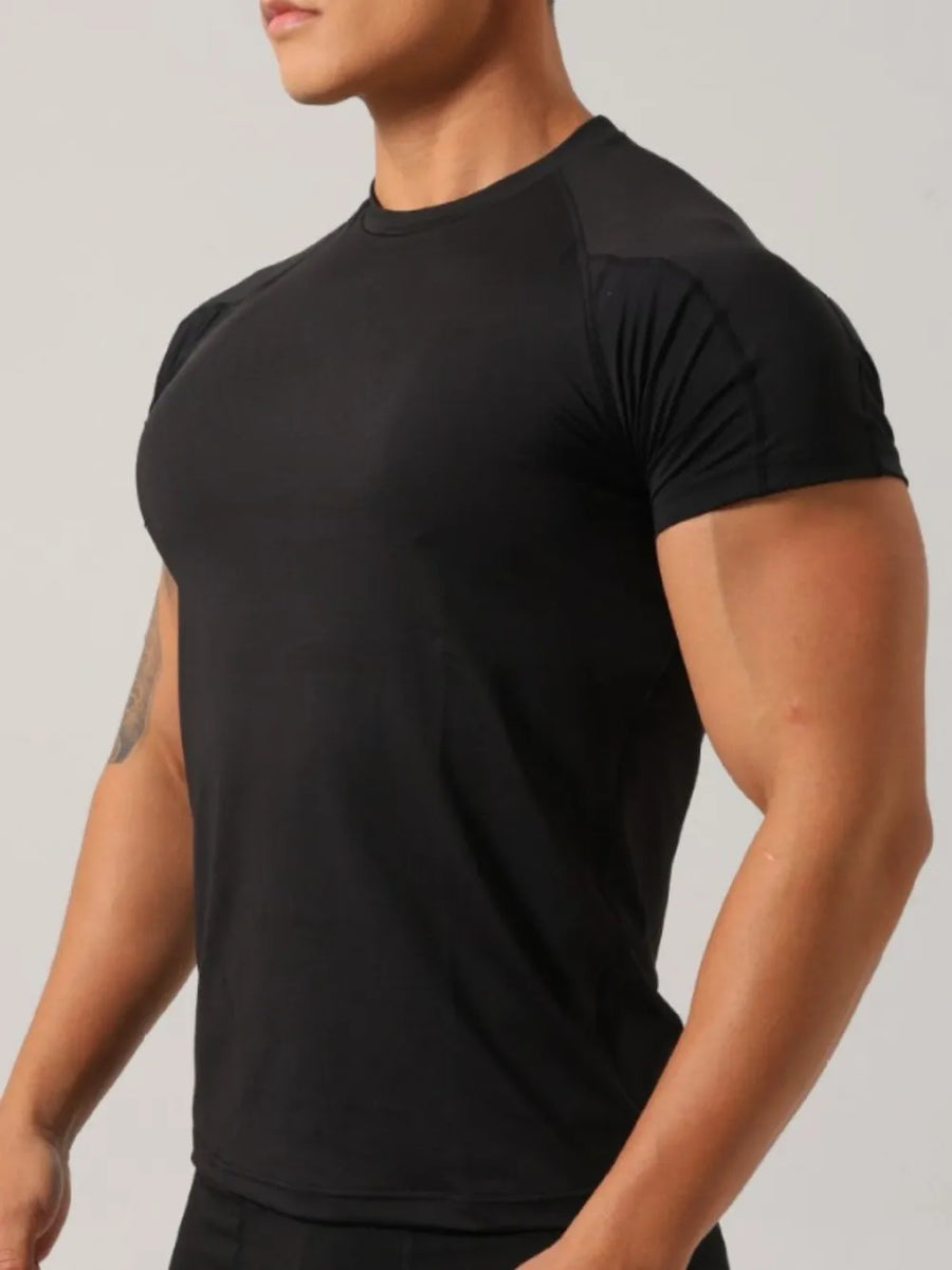 Black crew neck activewear t-shirt with short sleeves and a comfortable fit.
