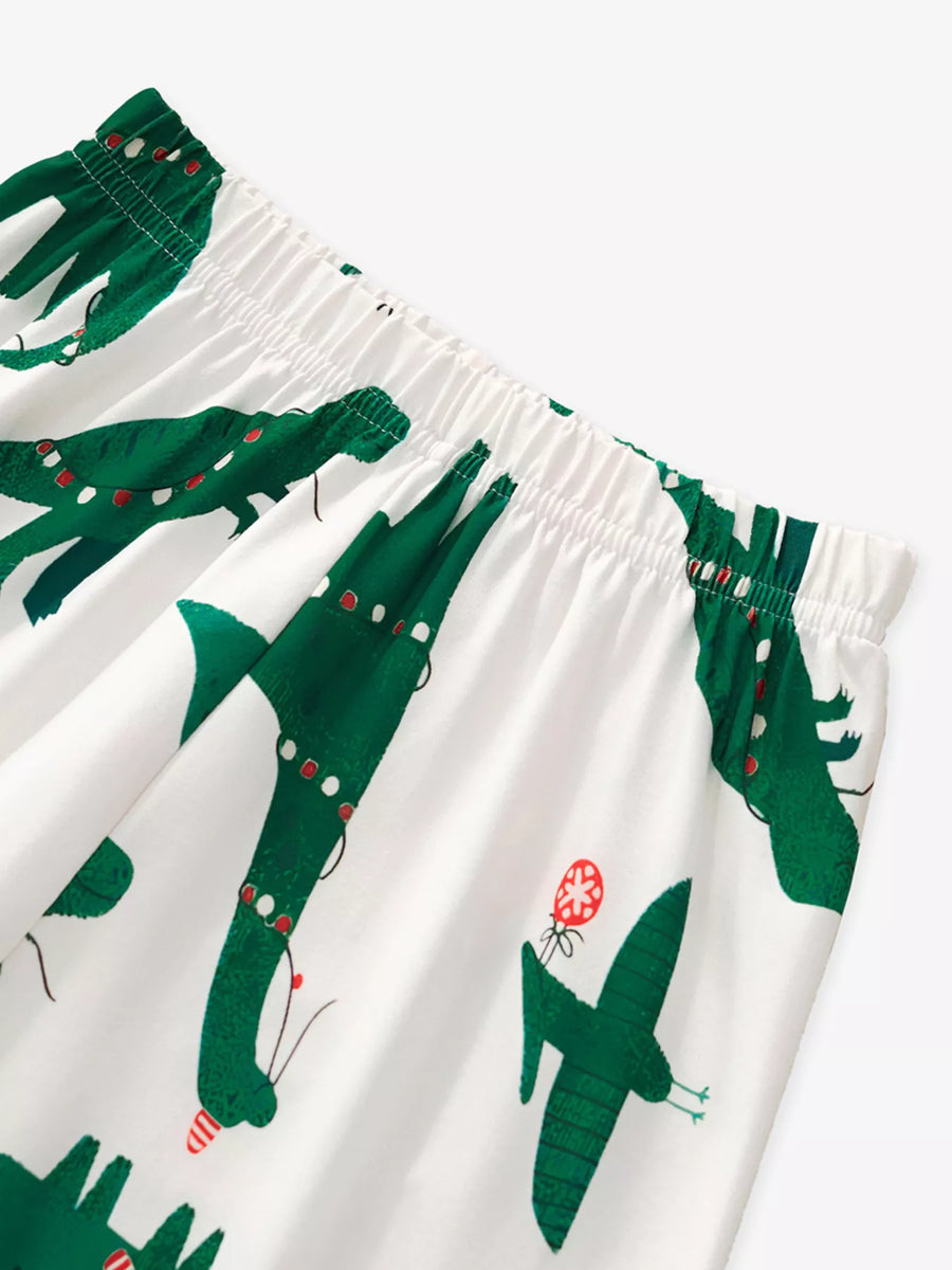 Kids' dark green dinosaur print pajama pants with elastic waistband
