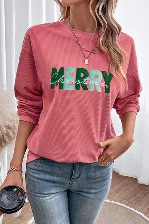 Textured corduroy sweatshirt in burnt coral with "Merry Christmas" graphic detail.
