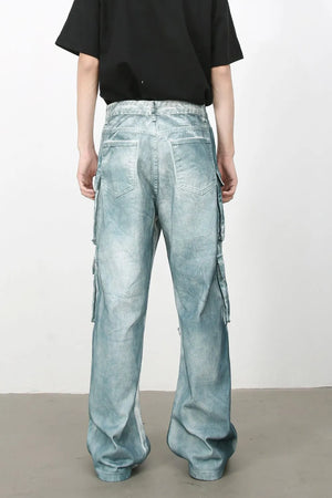 Bleached denim utility trousers in medium with multiple cargo pockets and a relaxed fit.