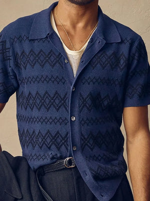 Navy geometric knit camp collar shirt with short sleeves and button front.