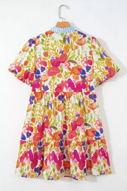 Vibrant floral tiered mini dress in cotton with short sleeves and a striped collar.