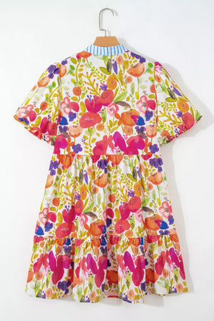Vibrant floral tiered mini dress in cotton with short sleeves and a striped collar.