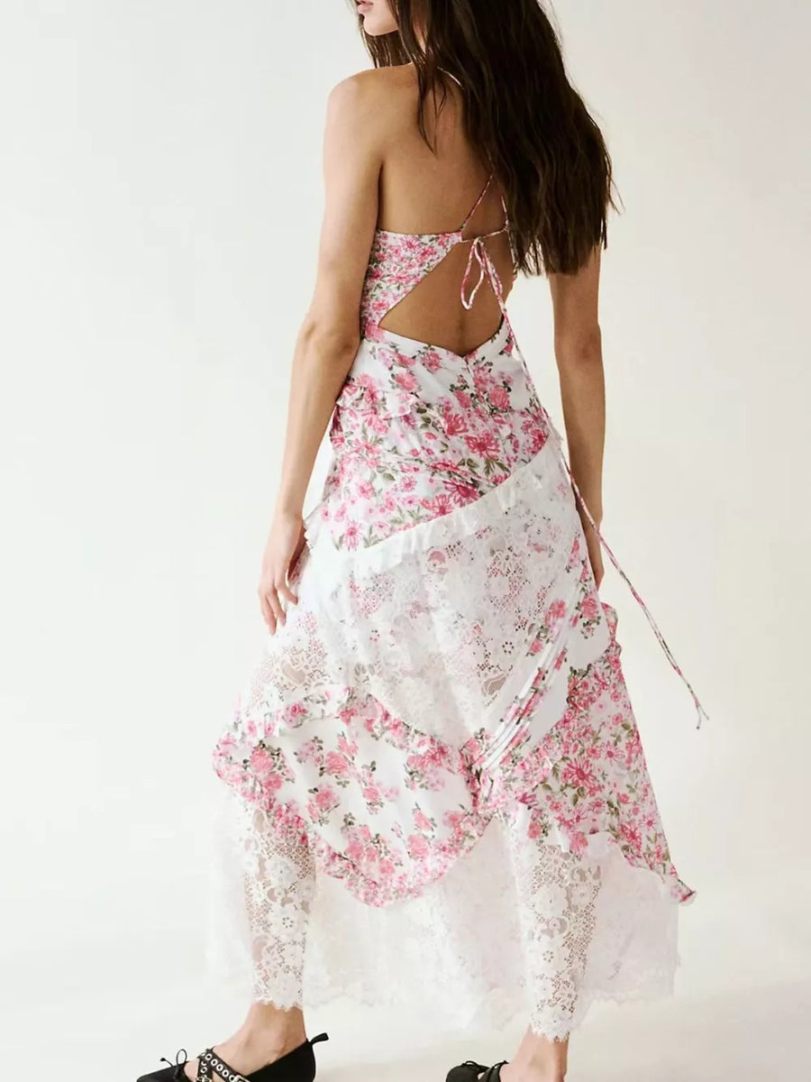 Floral lace maxi dress with ruffles and open back, featuring a pink floral print and white lace trim.