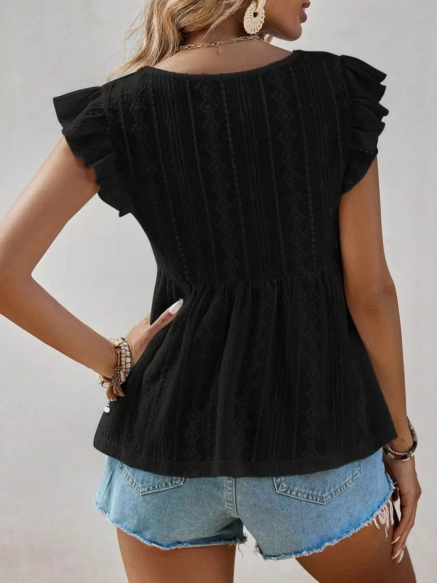 Black eyelet blouse with ruffle sleeves and peplum hem.