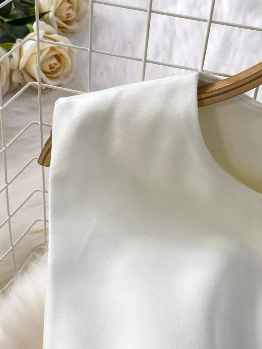 White belted two-piece set detail, sleeveless top with round neckline and pockets.
