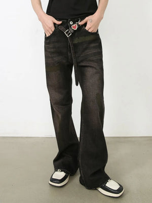 Faded flare jeans in dark distressed wash denim with a buttoned closure and belt.