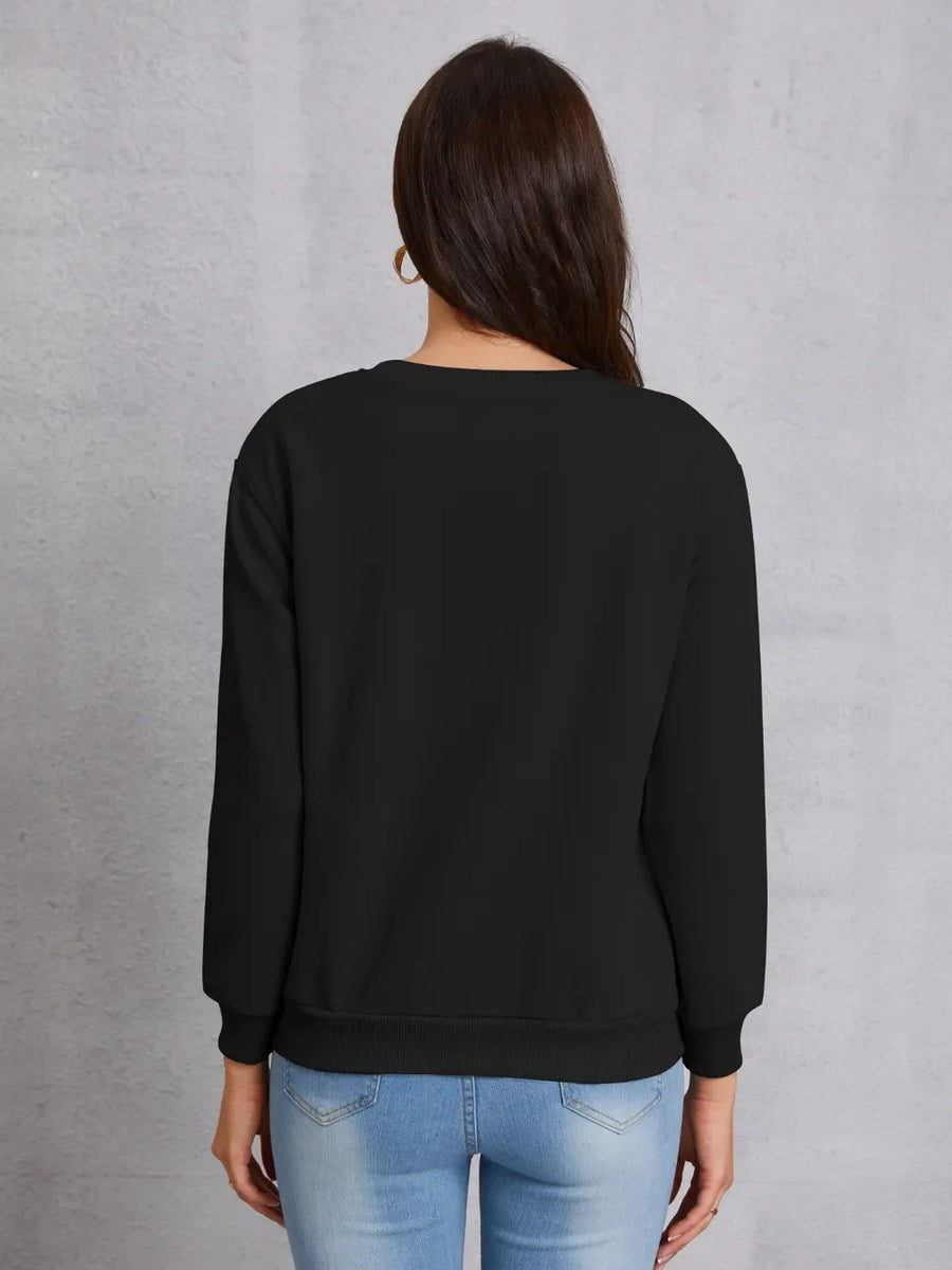 Black crewneck sweatshirt with ribbed cuffs and hem, casual basic style.