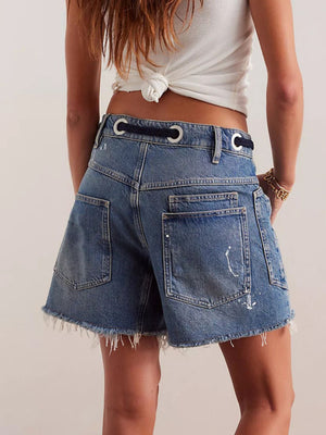 85% cotton, 15% polyester Care instructions: Machine wash cold denim shorts in White with relaxed silhouette