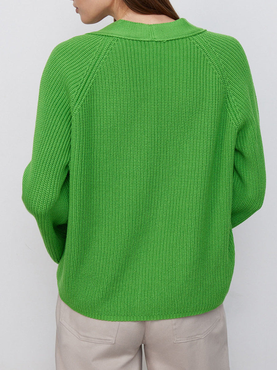 Green ribbed raglan cardigan with deep V-neck and button detail.