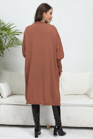 Brown long cardigan with balloon sleeves and a collared neckline.