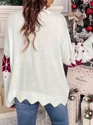 White acrylic blend sweater with red snowflake pattern on sleeves and scalloped hem.