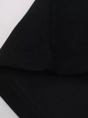 Black athletic t-shirt detail showing hem stitching and fabric texture.