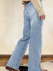 Light blue denim straight leg jeans with vintage wash and buttoned fly.