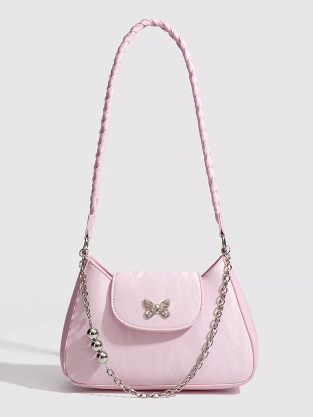 Pink shoulder bag with butterfly charm and silver bead chain detail