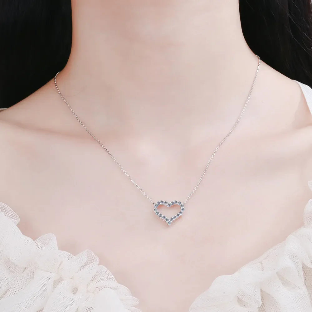 Silver open heart moissanite pavé pendant necklace with delicate chain.
