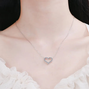 Silver open heart moissanite pavé pendant necklace with delicate chain.