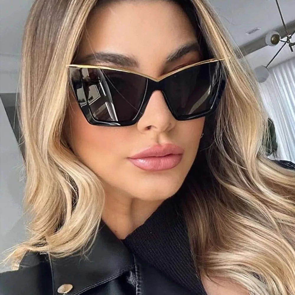 sunglasses in black featuring UV400 protection and cat-eye fit