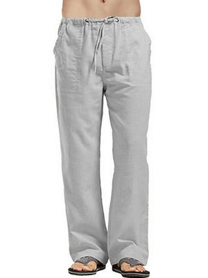 Gray linen drawstring trousers with a relaxed fit and pockets.