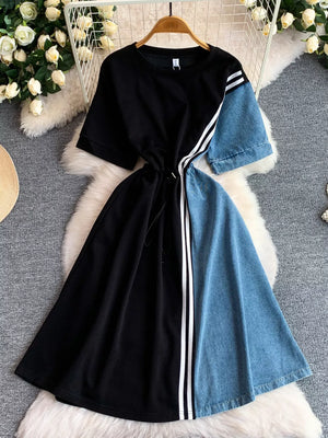 Black and denim color block casual dress with drawstring and white stripes.