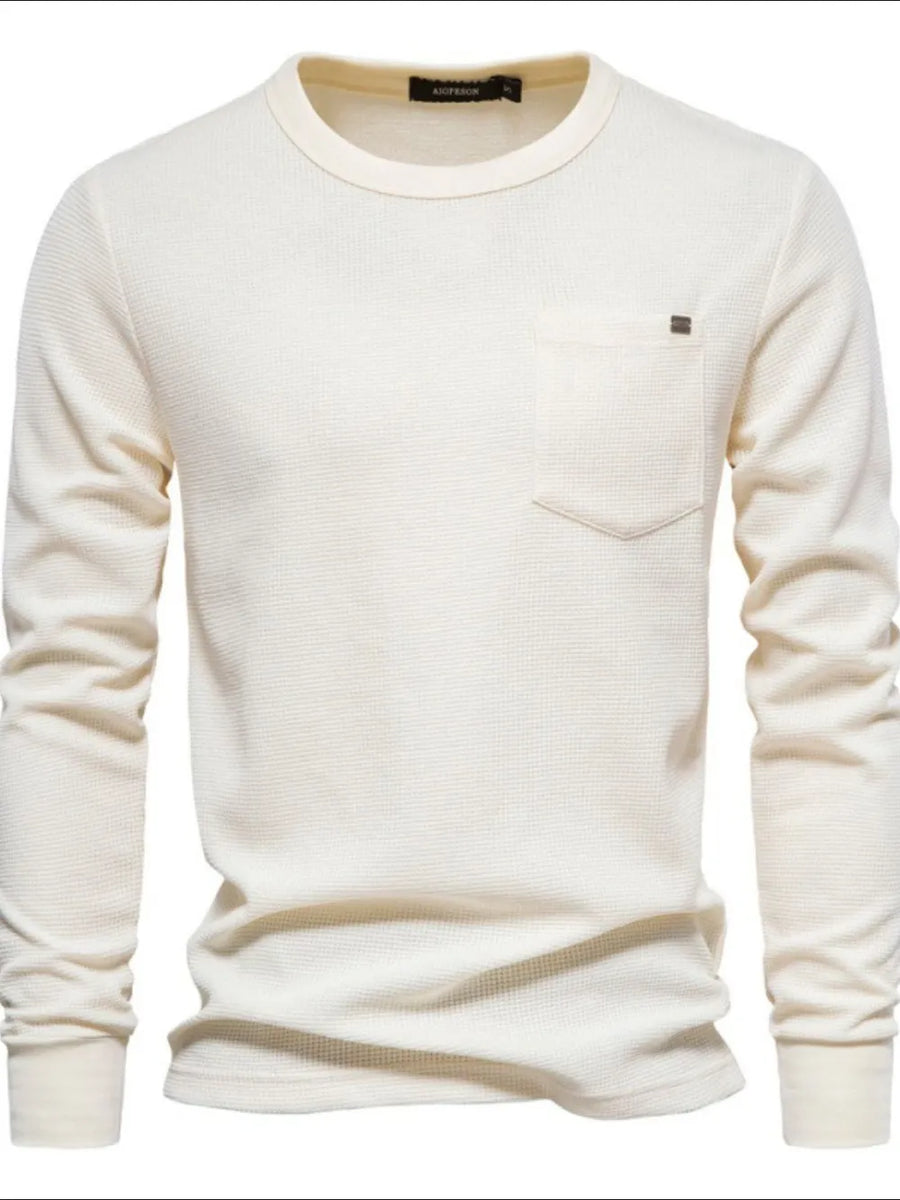 Ivory textured thermal long sleeve tee with chest pocket and minimalist detail.