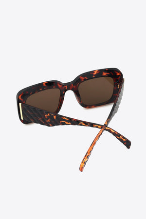 Tortoiseshell rectangular sunglasses with textured arms and brown lenses.