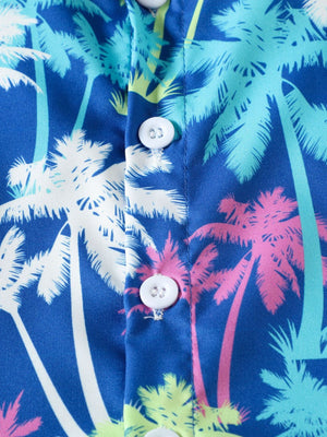 Toddler shirt with tropical palm tree print in blue, white, pink, and green.