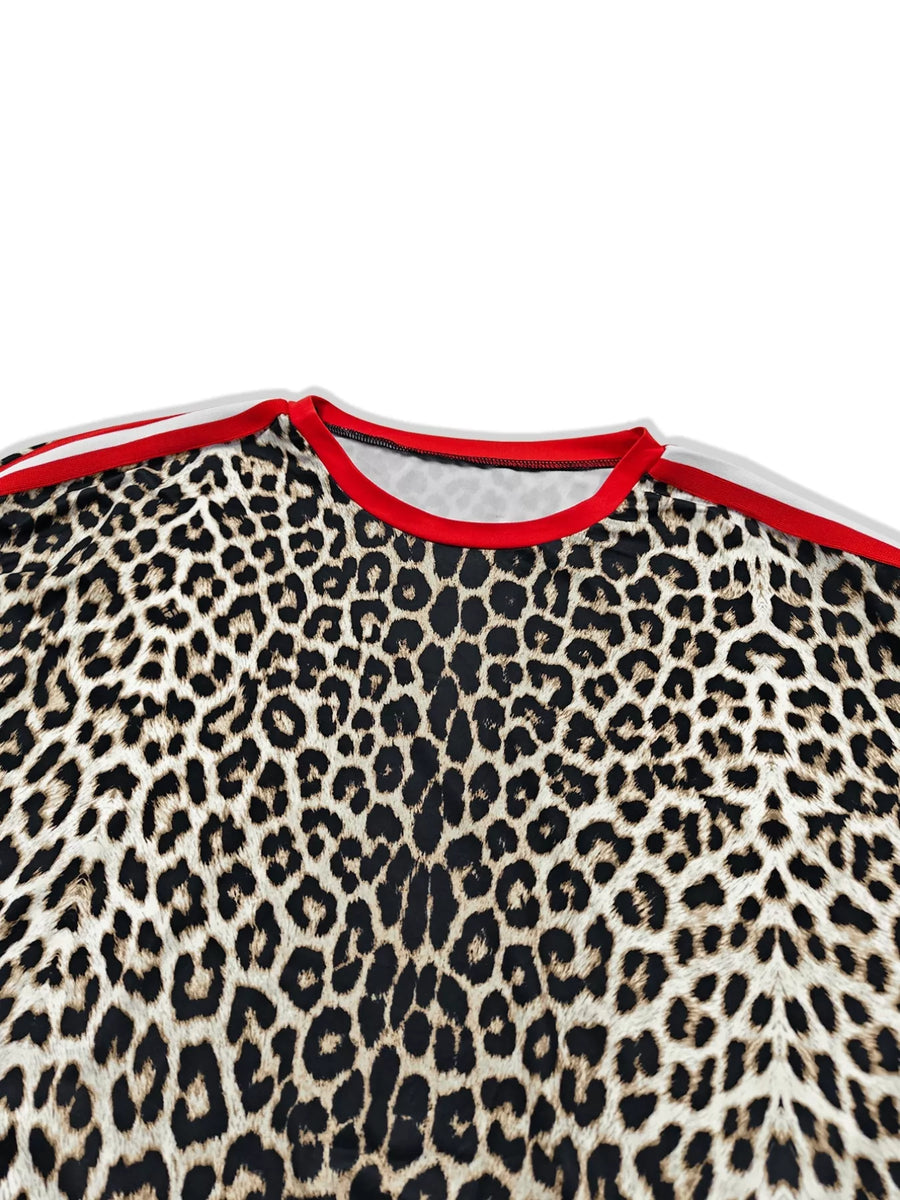 Leopard print loungewear top with red trim neckline and stripe detail on shoulders.