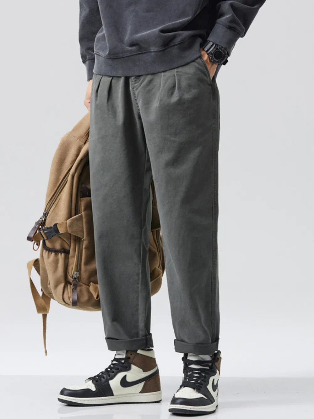 Men's relaxed fit gray sweatpants with pockets and drawstring waist.