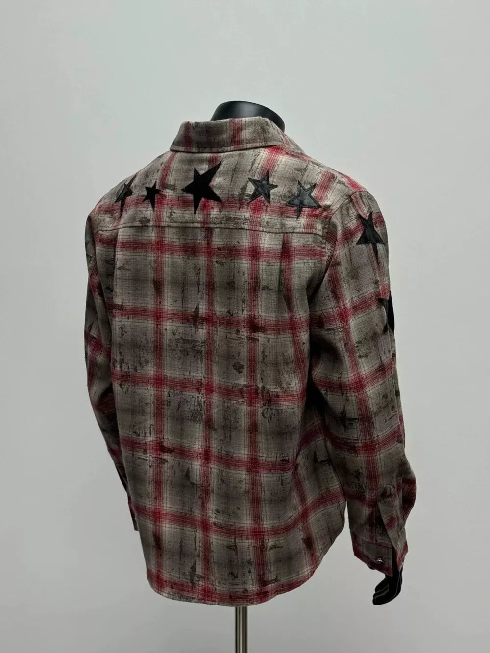 beige button-up shirt featuring chest pocket and plaid