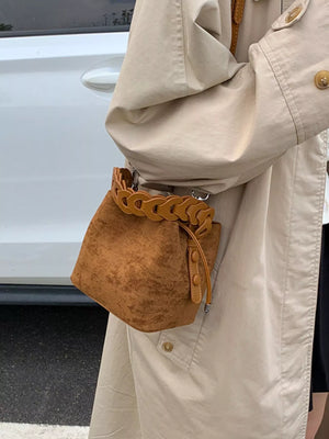 Brown suede mini chain strap crossbody bag with drawstring closure