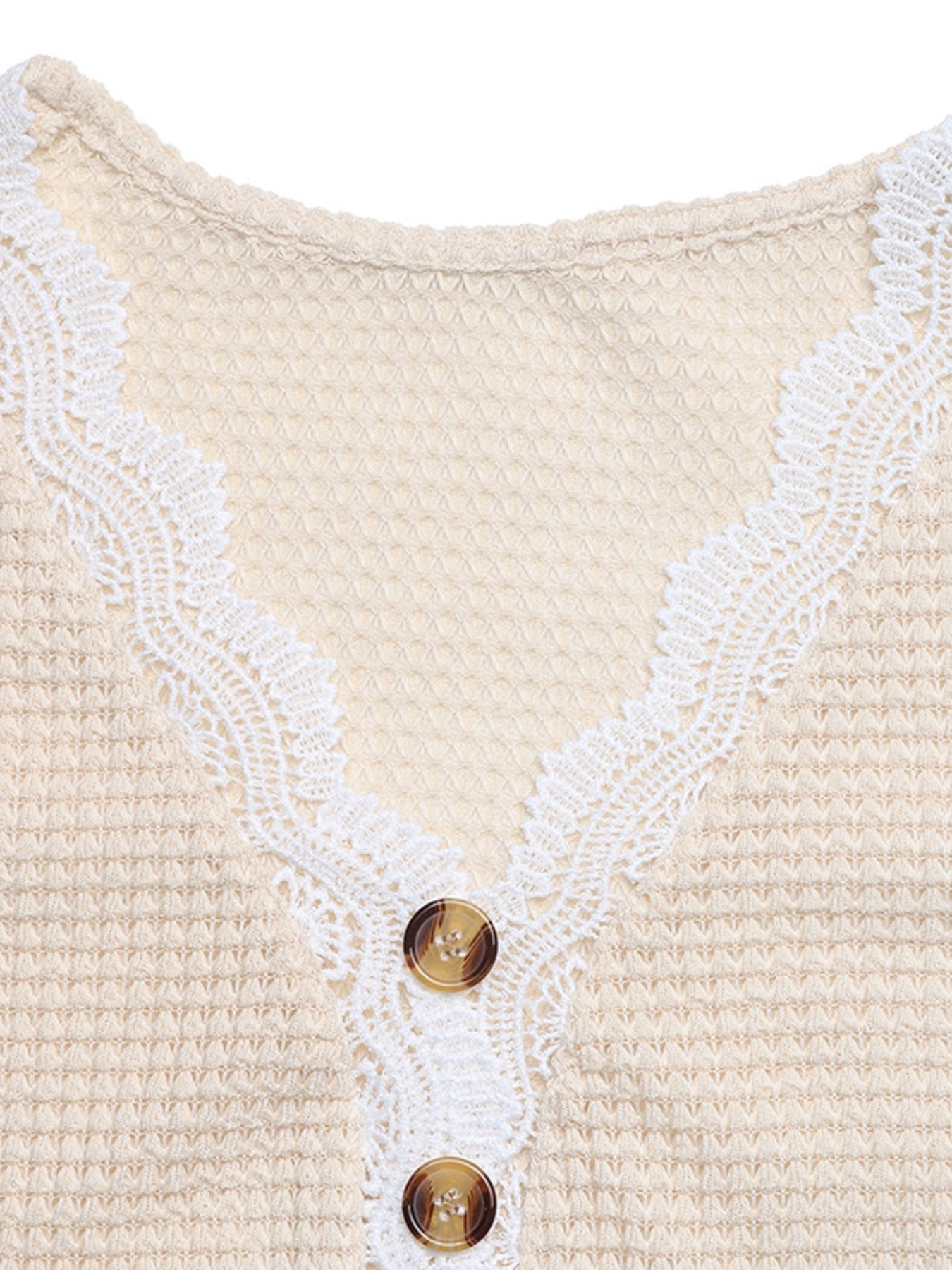 Apricot waffle knit maternity tee with V-neck, lace trim, and button detail.