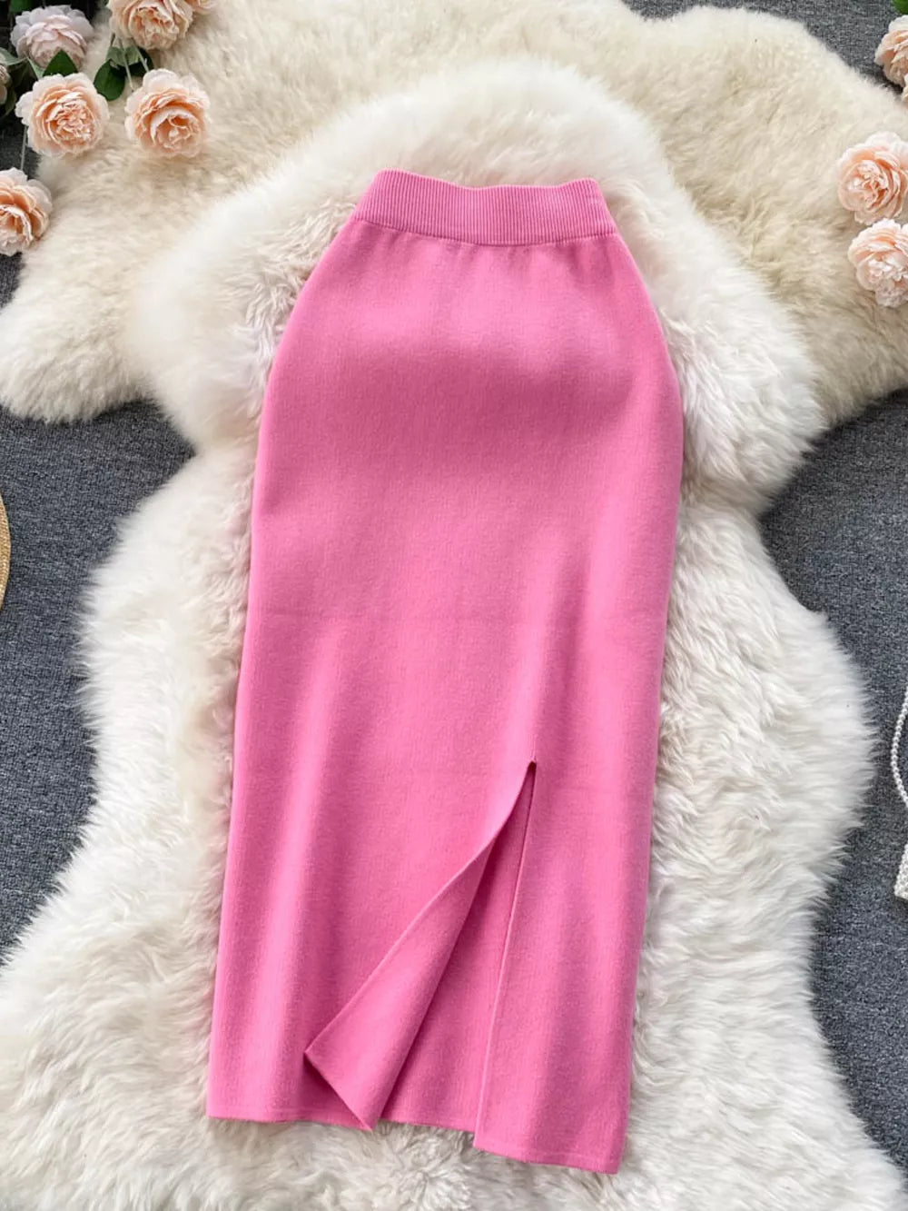 Pink knit midi skirt with a high waist and side slit