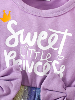 Lavender baby dress with "Sweet Little Princess" graphic, crown detail, and bow accents.