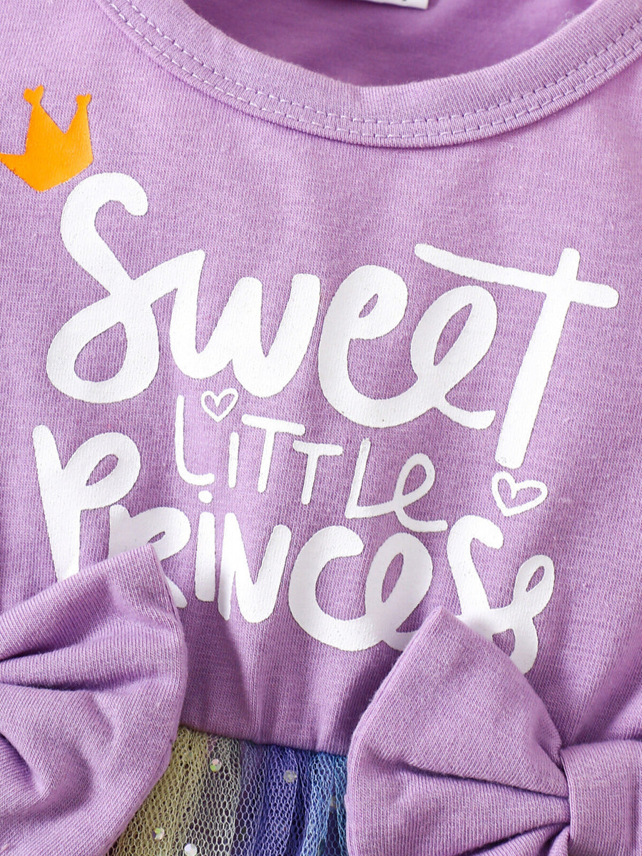 Lavender baby dress with "Sweet Little Princess" graphic, crown detail, and bow accents.