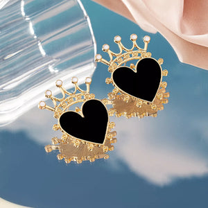 Black heart crown stud earrings with gold trim and white accents