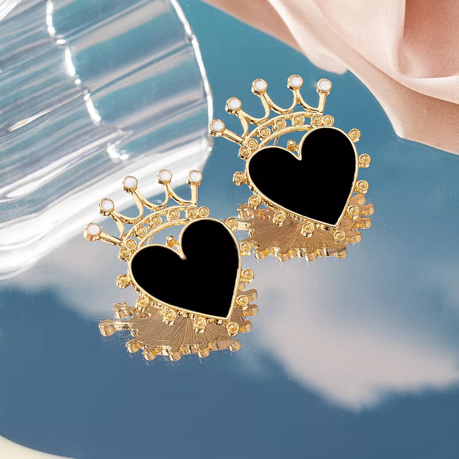Black heart crown stud earrings with gold trim and white accents