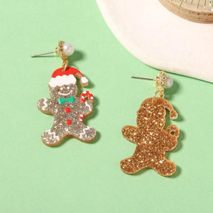 earrings in gold with novelty and dangle