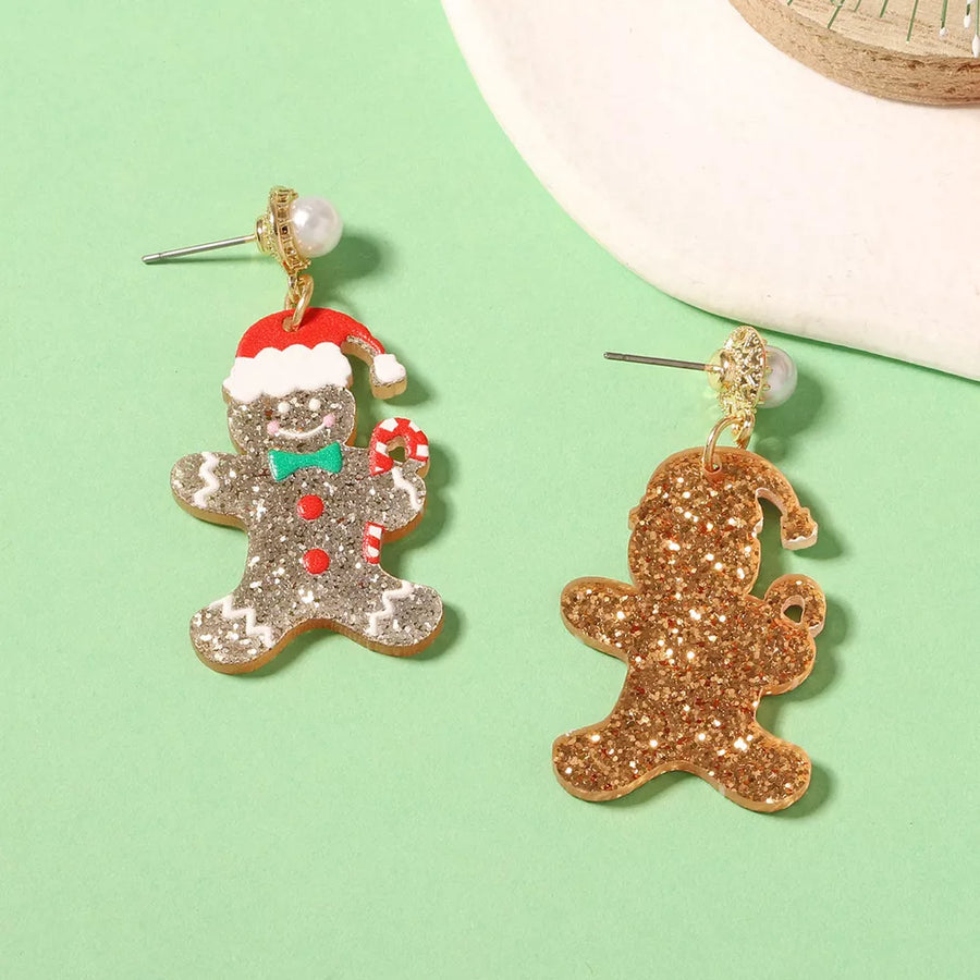 earrings in gold with novelty and dangle