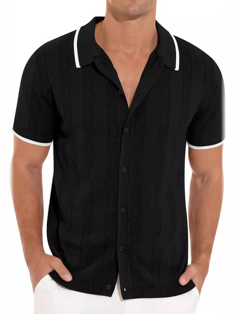 Black textured knit polo shirt with white contrast trim and button neckline.