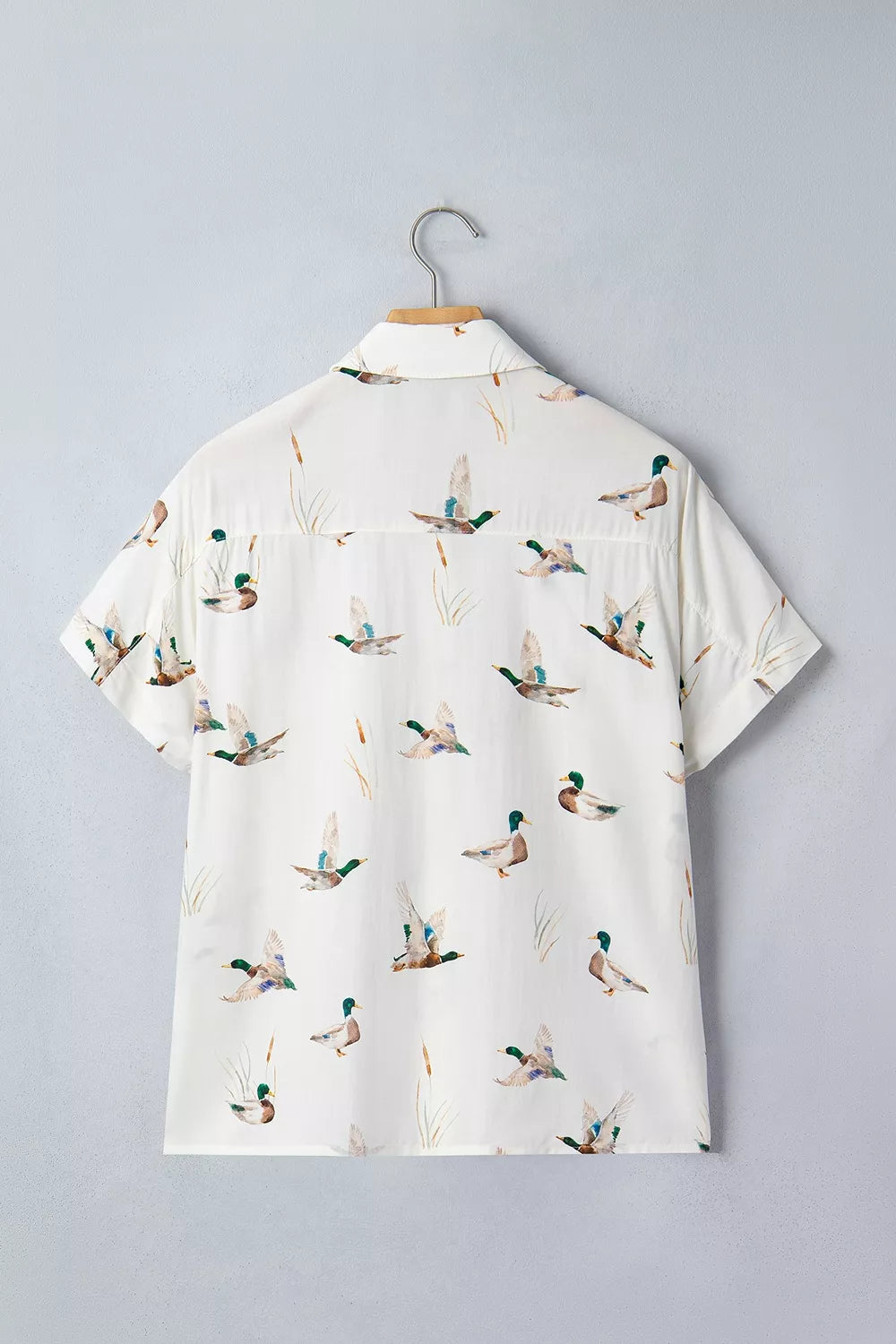 button-up shirt featuring animal-print in White with 55% cotton, 45% viscose Care instructions: Machine wash cold texture