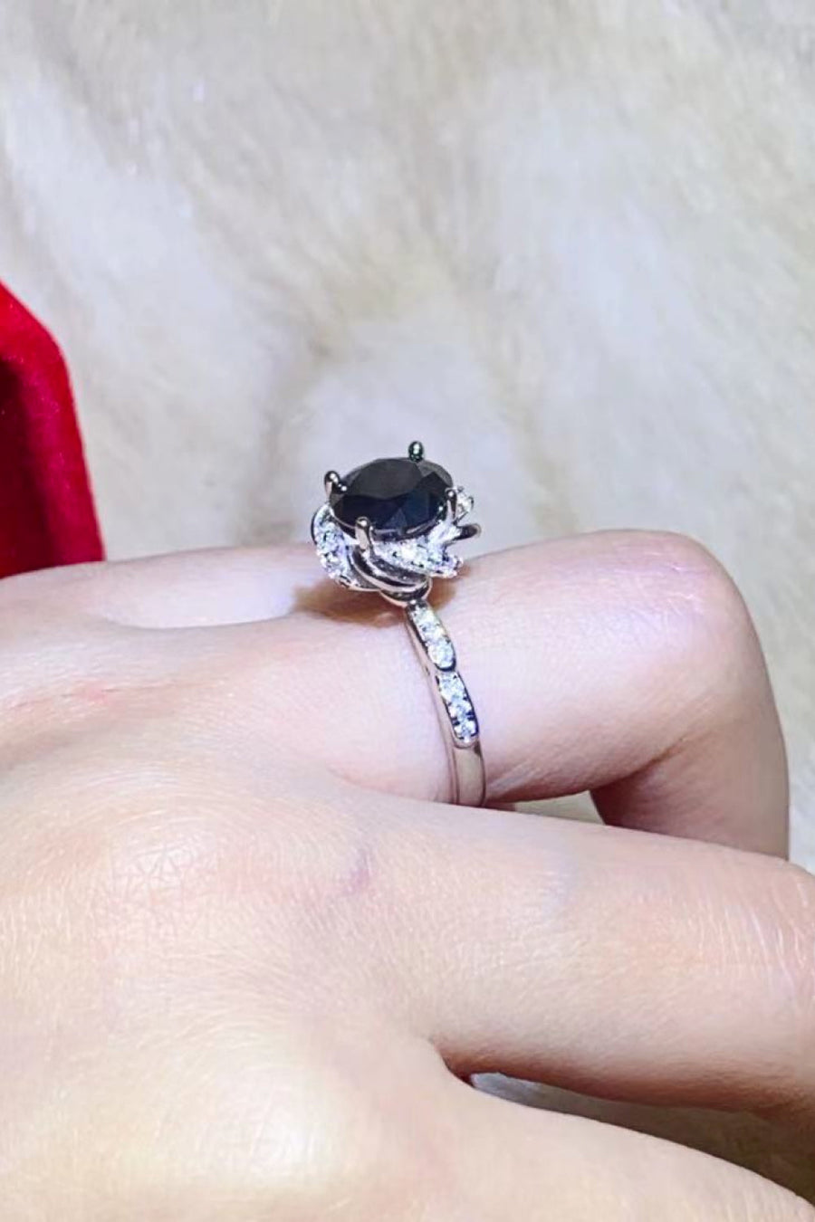 Black moissanite ring with diamond accent band and floral setting