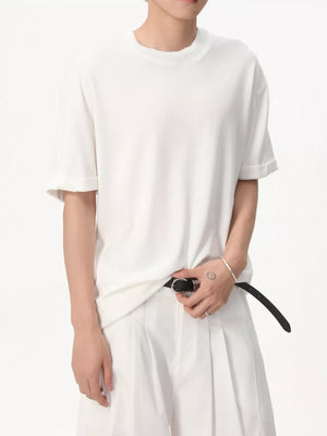 White cotton t-shirt with crew neck and cuffed short sleeves.