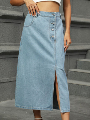 Button-front denim A-line skirt in medium wash with a high slit.