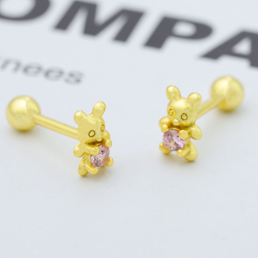 Gold bear stud earrings with pink zircon stones.