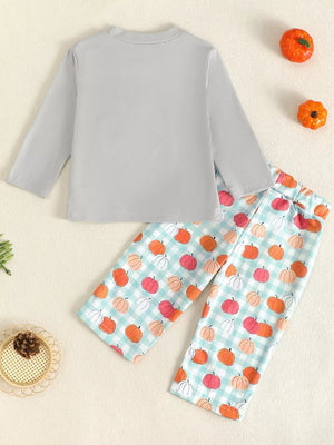 Baby girl's long sleeve top and pants set with pumpkin print on gingham pants.