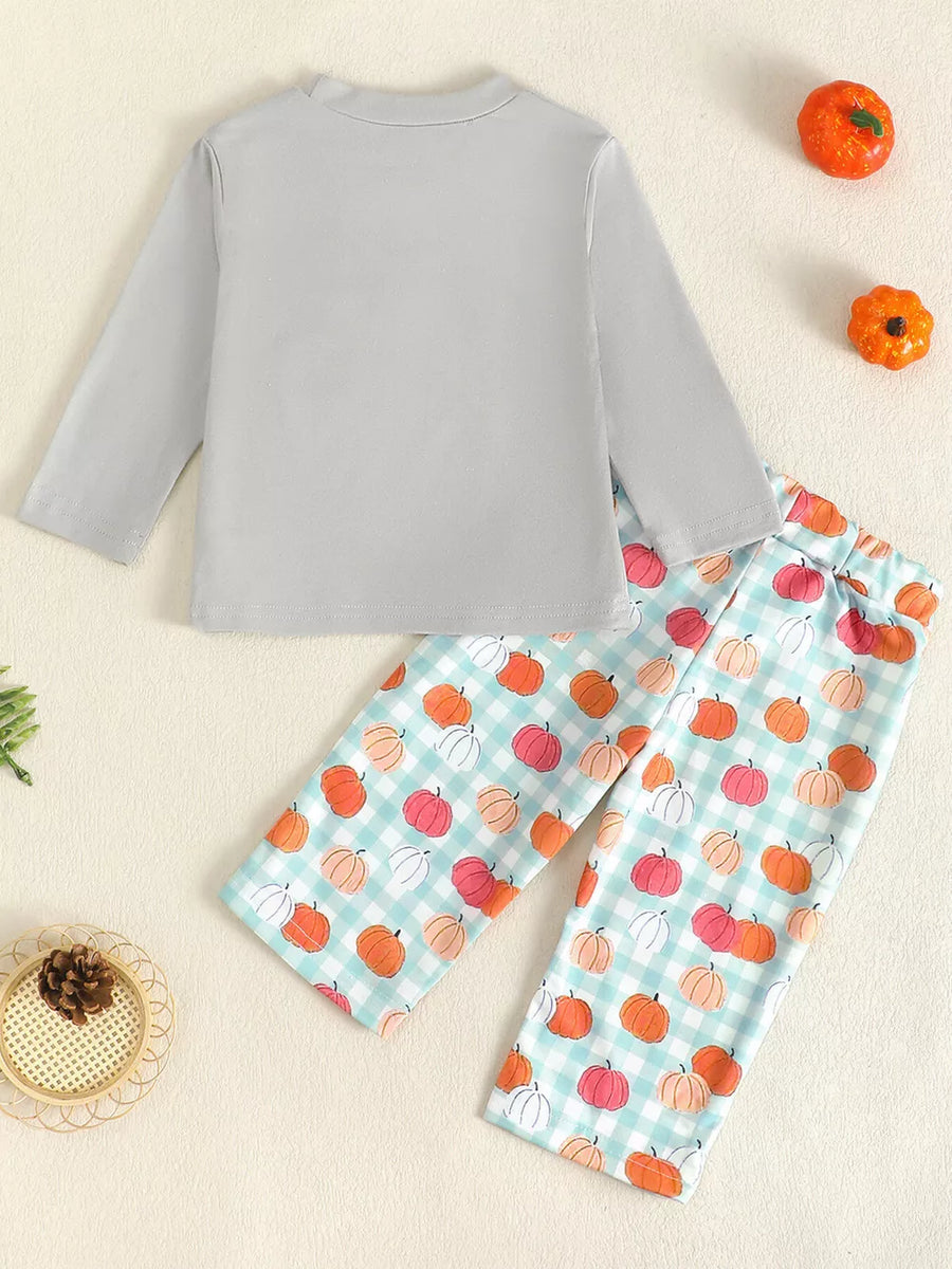 Baby girl's long sleeve top and pants set with pumpkin print on gingham pants.