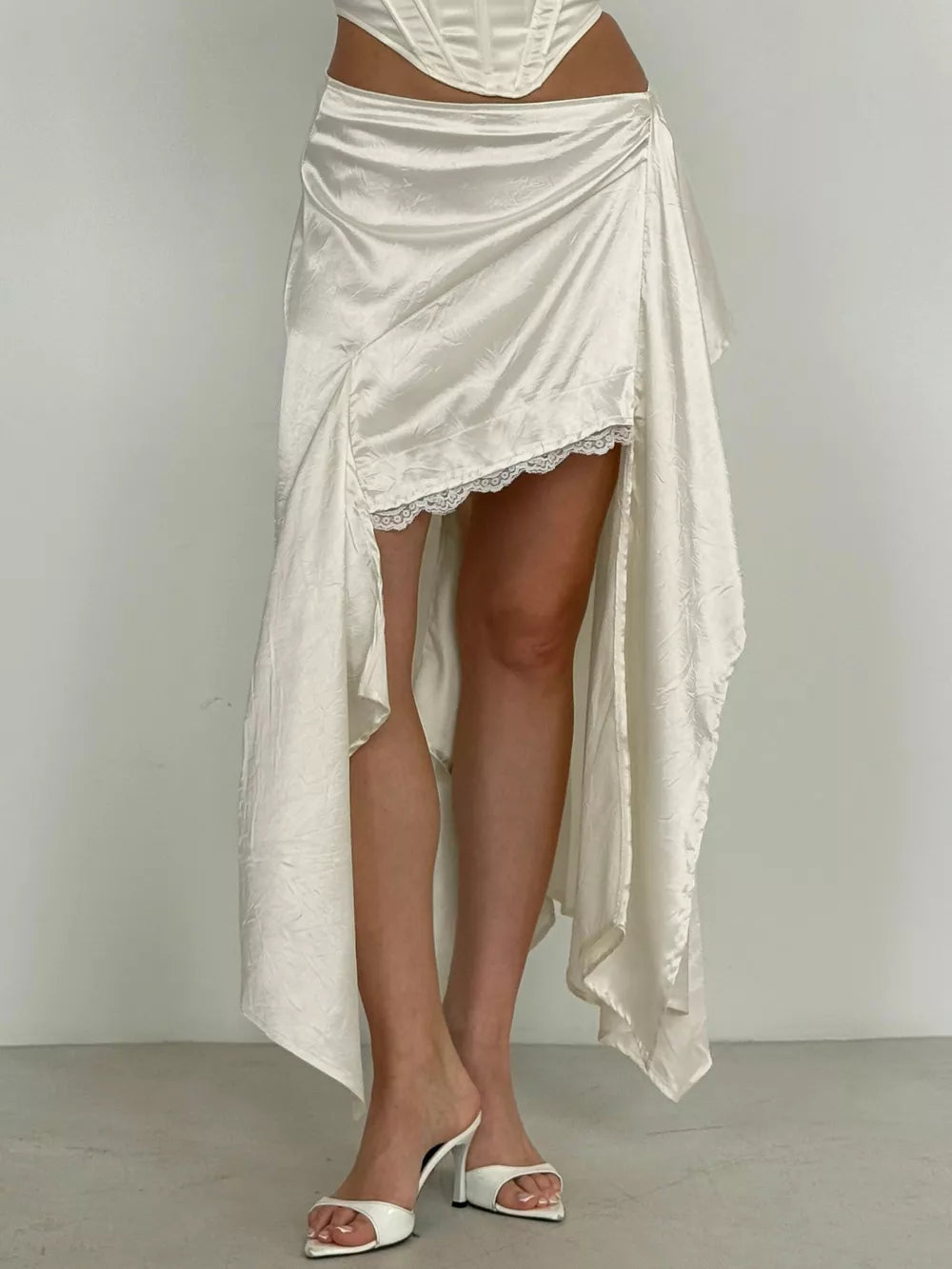 midi skirt in ivory featuring lace detail and flared fit