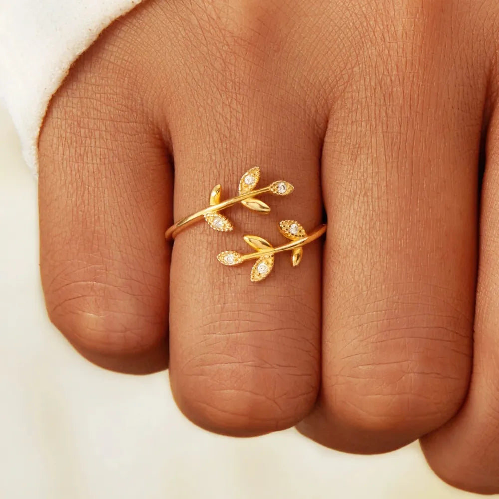 Gold vine ring with zirconia leaves, delicate boho style.